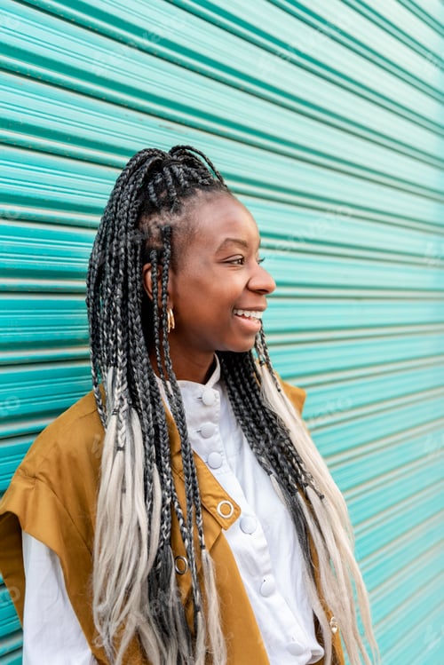 Preview: profile portrait of a beautiful woman with braids on a blue background
