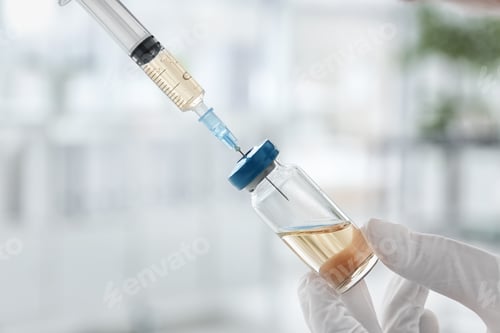 Preview: Doctor with syringe and medicine for vaccination on blurred background