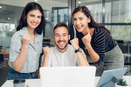 Preview: Happy diverse friends watching funny video together at meeting.