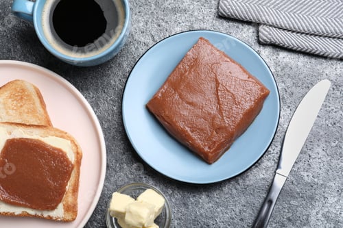 Preview: Quince paste with sandwich served for breakfast on grey table, flat lay