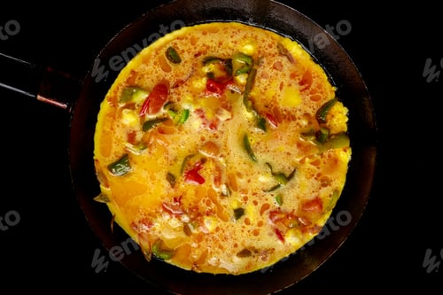 Preview: Eggs and vegetables are mixed together to make vegetarian omelet.