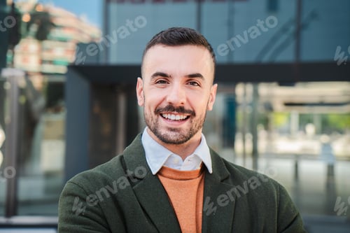 Preview: Front view of young adult man with friendly and positive expression. Close up portrait of handsome