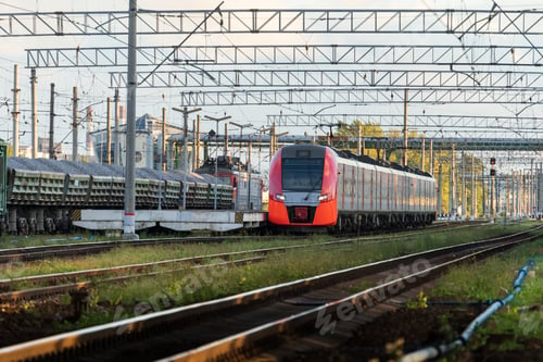 Preview: Modern intercity high speed train at sunset. Commercial suburban transportation concept.