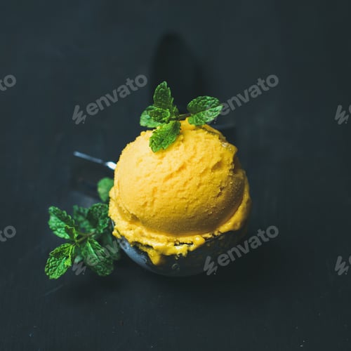 Preview: Refreshing Mango sorbet ice-cream scoop in scooper, square crop