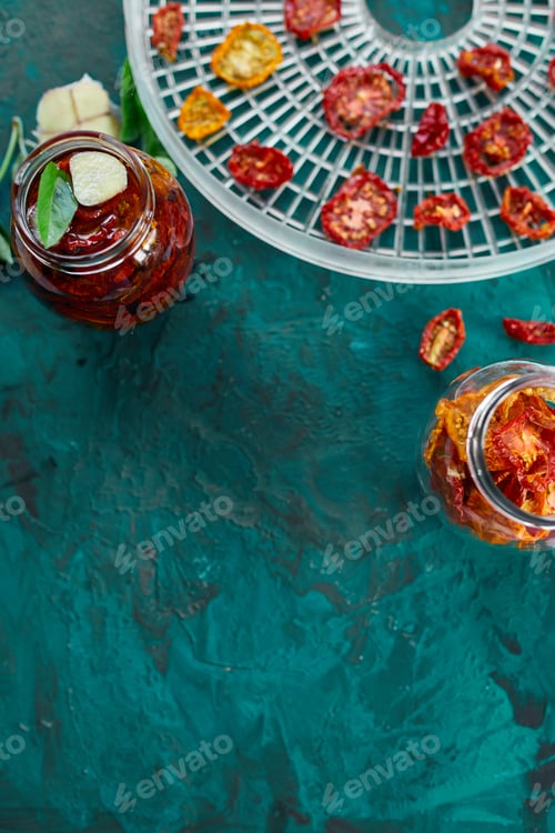 Preview: Homemade sun dried tomatoes with herbs, garlic in olive oil in a glass jar