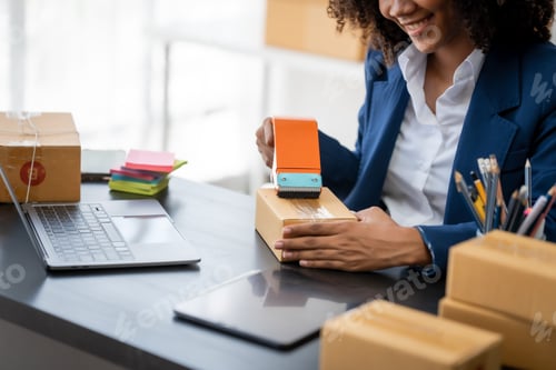 Preview: Pretty young african american woman start up freelance business people is working at warehouse