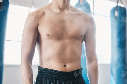 Preview: Sports, boxing and abdomen of man with muscle in gym for training, workout and exercise for mma. Fi
