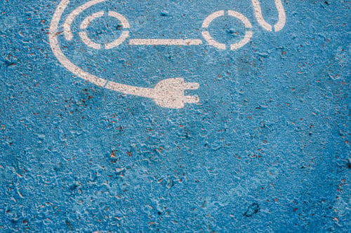 Preview: Electric car charging station signal painted on the floor of a car park,