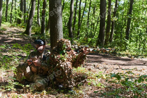 Preview: A skilled sniper and a soldier operating a drone with VR goggles strategize and observe the military