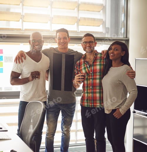 Preview: Friends smiling and standing together in office