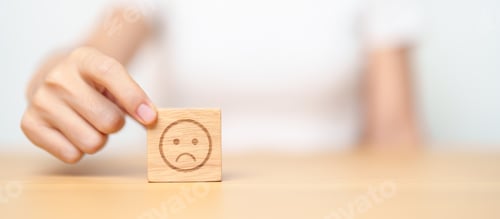 Preview: Hand choosing unhappy angry face from Emotion block.
