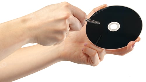 Preview: hand holds a compact disk(cd) isolated