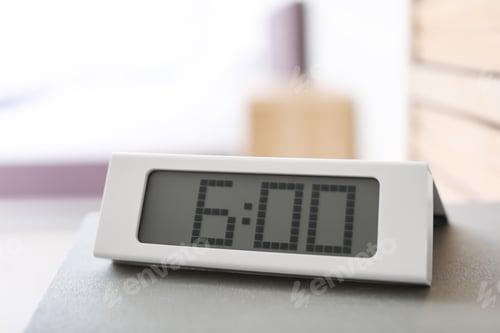 Preview: Digital alarm clock on table. Time to wake up