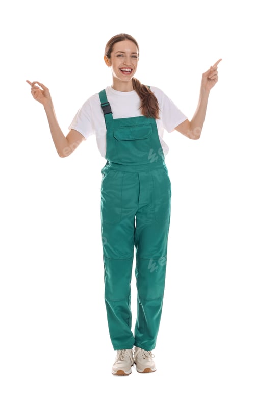 Preview: Smiling cleaning service worker pointing at something on white background