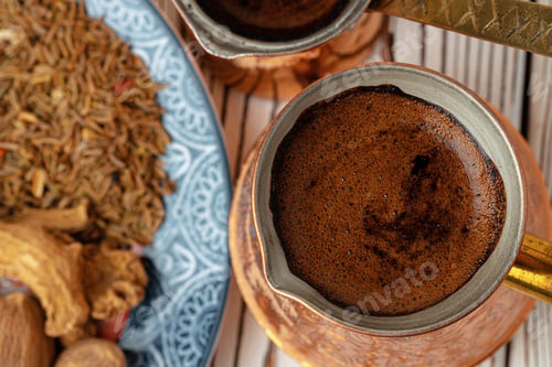 Preview: Coffee in metal turk with spices in a plate