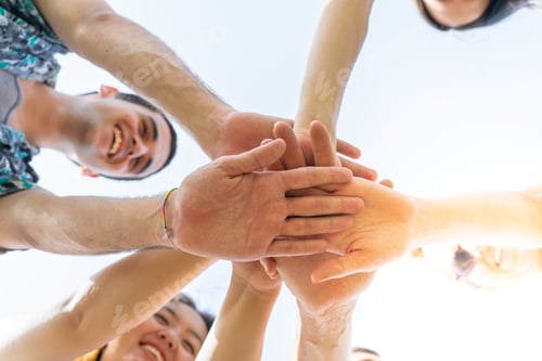Preview: Teamwork, unity concept, group of friends put their hands together.