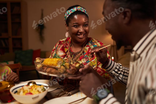 Preview: Woman Offering Dish to Husband