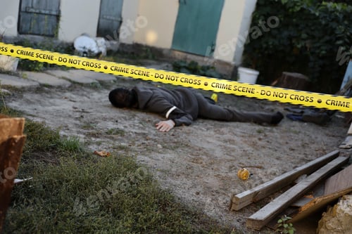 Preview: Victim of a violent crime in a backyard of residental house in evening