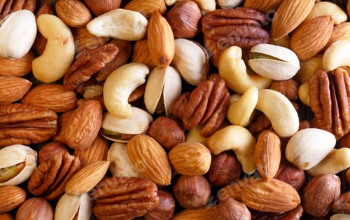 Preview: Background texture of assorted mixed nuts including cashew, peca