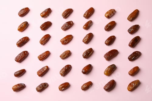 Preview: Flat lay with tasty dates on pink background