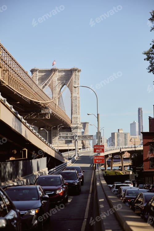 Preview: heavy traffic on famous Brooklyn bridge in rush hour in new york city, metropolis atmosphere