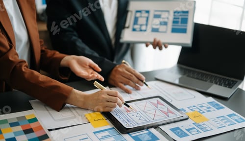 Preview: UX developer and ui designer brainstorming about mobile app interface wireframe design with customer