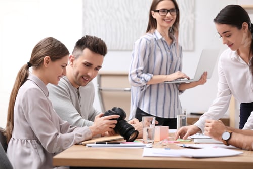 Preview: Team of professional journalists working in office