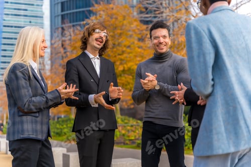 Preview: Middle-aged multi-ethnic businessmen and businesswomen enjoying good work environment and smiling