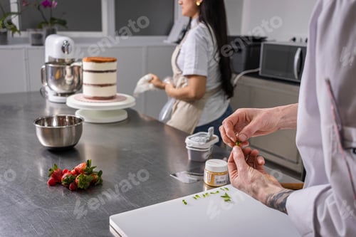 Preview: Close-up of a professional chef's hands working with fruit.