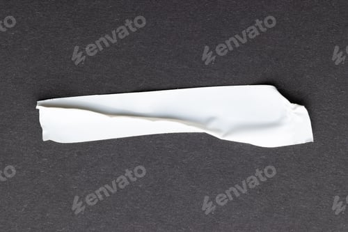 Preview: Ripped up piece of white tape with copy space on black background