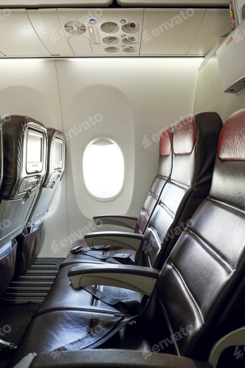 Preview: Inflight economy class cabin seats of an airplane.