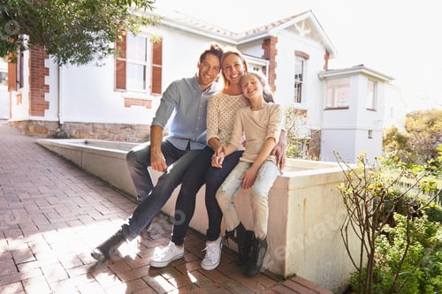 Preview: My family is my home. A portrait of a happy family sitting outside of their home.