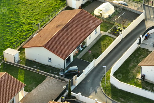Aperçu: Aerial view of residential houses in green suburban rural area