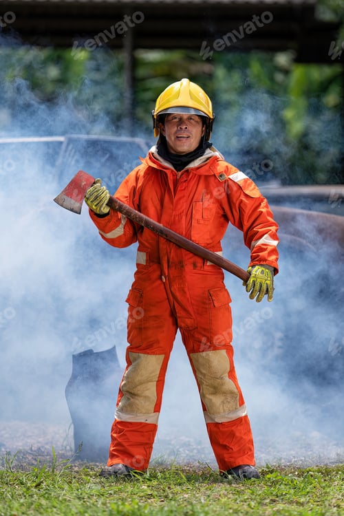Preview: Fireman wearing fire protection suite and oxygen tank hold axe portrait heavy smoke in background