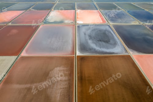 Preview: Aerial drone photo of colourful salt flats textures in Phetchaburi, Thailand