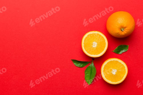 Preview: fresh Fruit orange slices on colored background. Top view. Copy Space. creative summer concept