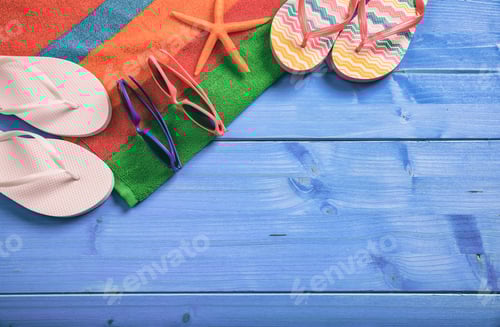 Preview: Summer vacation concept on blue wooden background - top view