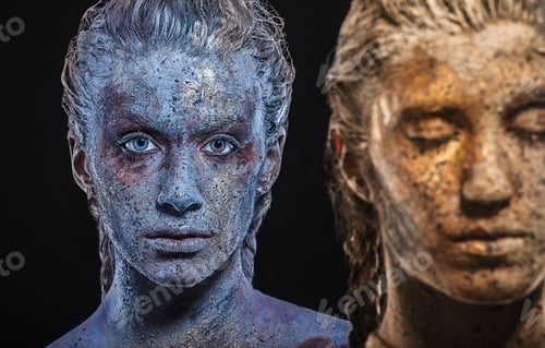 Preview: Paint covered young women looking at camera