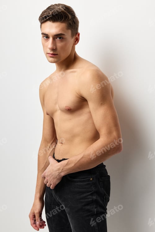 Preview: handsome man fashion hairstyle nude torso cropped view studio posing