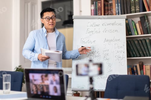 Preview: Korean Tutor Having Online Lesson Of English Standing In Library