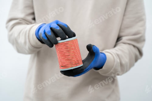 Preview: Mechanic Holds New Oil Filter