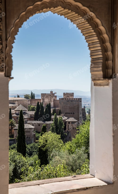 Preview: One of the windows of Generalife Alhambra with the Alambra in the background