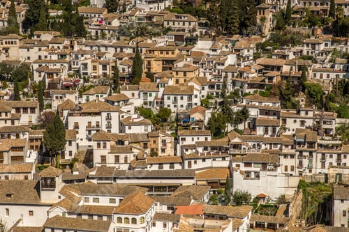 Preview: Wide angle shot of white buildings of a city constructed next to each other during daytime