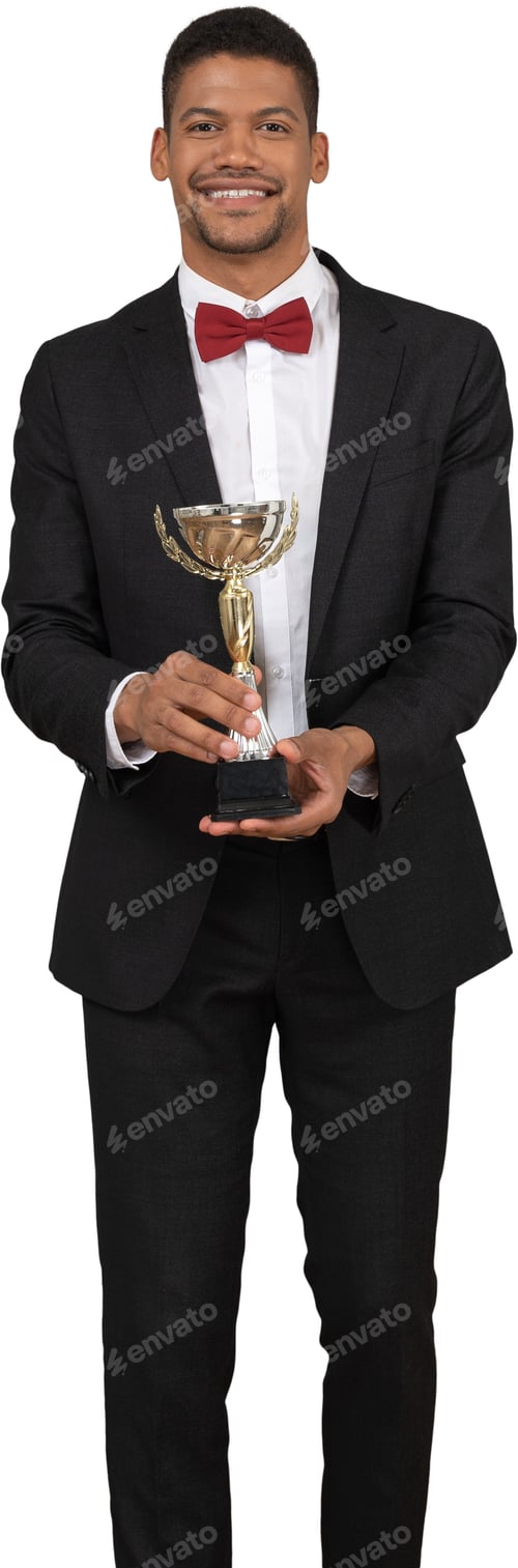 Preview: a man in a suit and bow tie holding a trophy