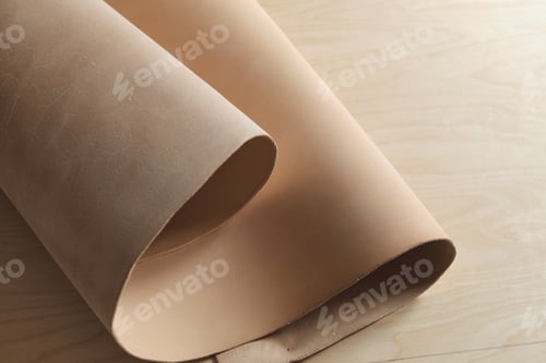 Preview: collection of high-quality beige leather swatches in various shades, showcasing their natural