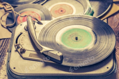 Preview: Vintage gramophone with few scratched vinyl records.