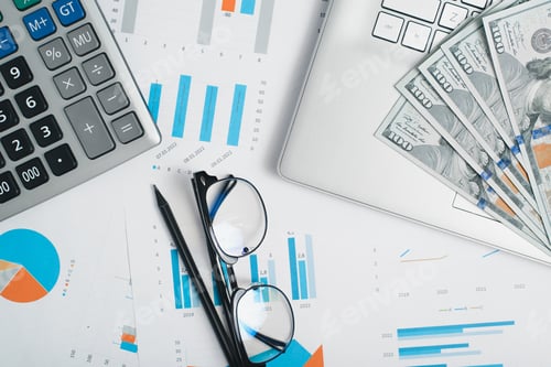 Preview: Top view workplace, calculator, laptop, money, glasses and pencil on financial business