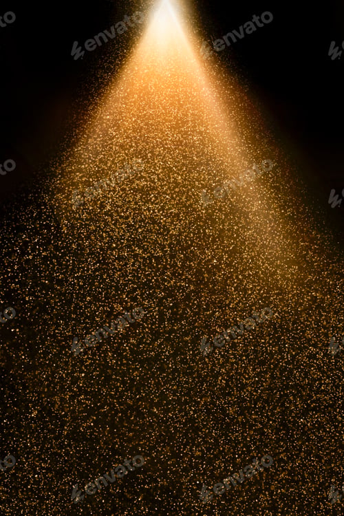 Preview: Golden particles falling from a light beam on black background