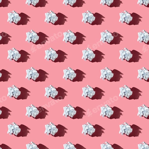 Preview: seamless pattern of crumpled white paper ball on a pink background with hard light