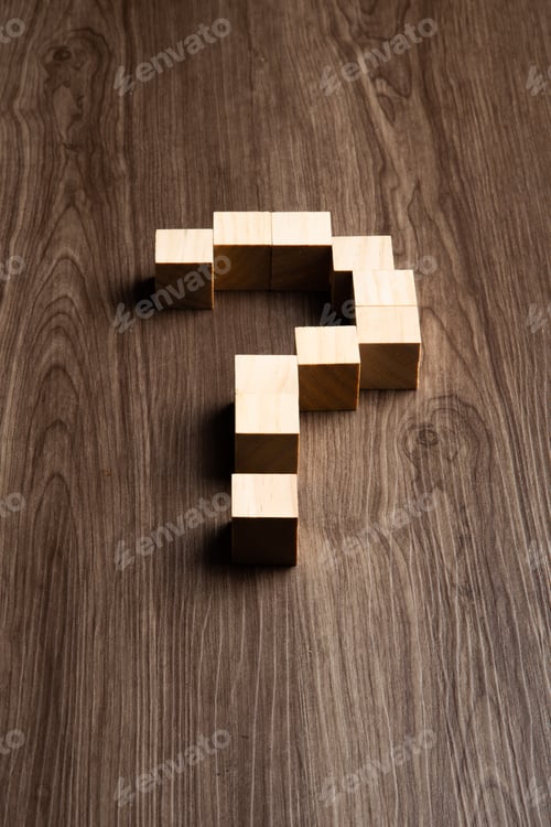 Preview: Forming bigger question mark. question mark on wooden table background